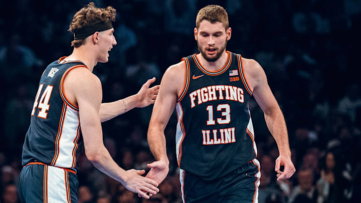 Illinois center Tomislav Ivisic (13) receives encouragement from twin brother and Illini forward Zvonimir Ivisic (44) during Illinois' 74-61 loss to UConn on Friday at Madison Square Garden in New York City.