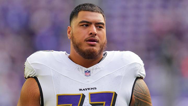 Nov 9, 2025; Minneapolis, Minnesota, USA; Baltimore Ravens guard Daniel Faalele (77) warms up before the game against the Minnesota Vikings at U.S. Bank Stadium. Mandatory Credit: Brad Rempel-Imagn Images