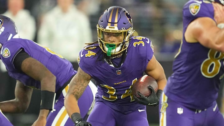 Nov 7, 2024; Baltimore, Maryland, USA; Baltimore Ravens Keaton Mitchell (34) runs for a second quarter gain against the Cincinnati Bengals at M&T Bank Stadium. Mandatory Credit: Mitch Stringer-Imagn Images