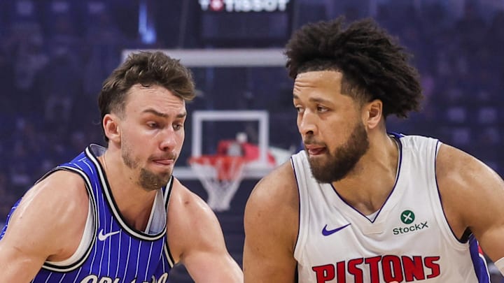 Detroit Pistons guard Cade Cunningham drives around Orlando Magic forward Franz Wagner.