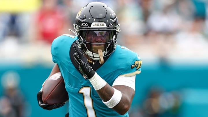 Oct 6, 2024; Jacksonville, Florida, USA; Jacksonville Jaguars running back Travis Etienne Jr. (1) runs with the ball against the Indianapolis Colts in the first quarter at EverBank Stadium. Mandatory Credit: Nathan Ray Seebeck-Imagn Images Oct 6, 2024; Jacksonville, Florida, USA; Jacksonville Jaguars running back Travis Etienne Jr. (1) runs with the ball against the Indianapolis Colts in the first quarter at EverBank Stadium. Mandatory Credit: Nathan Ray Seebeck-Imagn Images