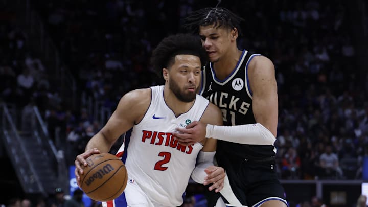 Apr 08, 2026; Detroit, Michigan, USA; Detroit Pistons guard Cade Cunningham (2) drives to the basket against Milwaukee Bucks forward Ousmane Dieng (21) in the second half at Little Caesars Arena. Mandatory Credit: Rick Osentoski-Imagn Images