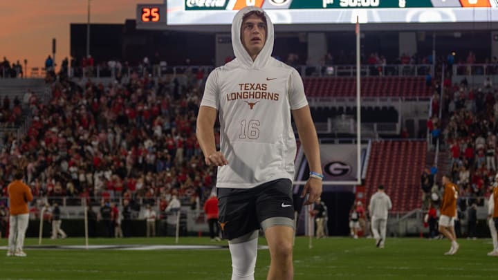 Texas Longhorns quarterback Arch Manning (16) warms up before a game against the Georgia Bulldogs at Sanford Stadium.