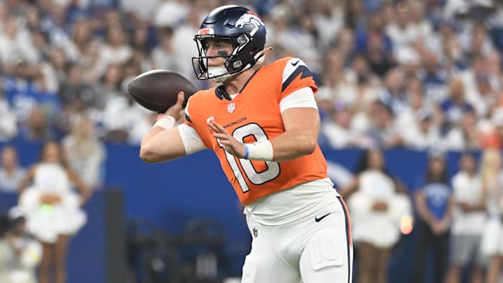 Sep 14, 2025; Indianapolis, Indiana, USA;  Denver Broncos quarterback Bo Nix (10) looks to pas the ball during the first quarter against the Indianapolis Colts at Lucas Oil Stadium.