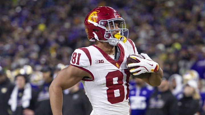Nov 2, 2024; Seattle, Washington, USA; USC Trojans wide receiver Kyle Ford (81) runs into the end zone for a touchdown reception against the Washington Huskies during the fourth quarter at Alaska Airlines Field at Husky Stadium. Mandatory Credit: Joe Nicholson-Imagn Images