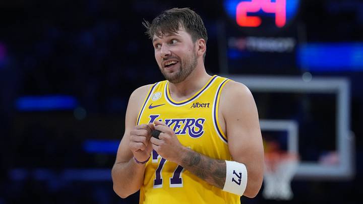 Oct 21, 2026; Los Angeles, California, USA; Los Angeles Lakers guard Luka Doncic (77) reacts against the Golden State Warriors in the first half at Crypto.com Arena. Mandatory Credit: Kirby Lee-Imagn Images