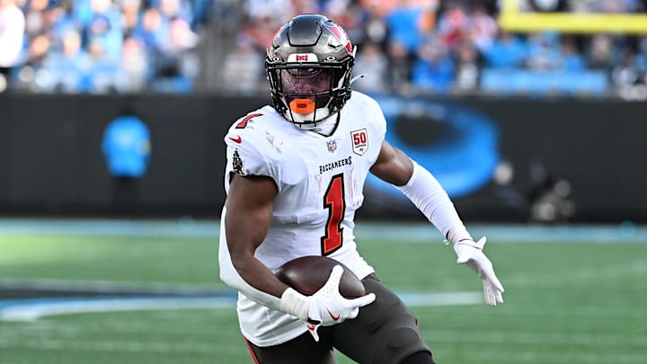 Dec 21, 2025; Charlotte, North Carolina, USA; Tampa Bay Buccaneers running back Rachaad White (1) with the ball in the third quarter at Bank of America Stadium.