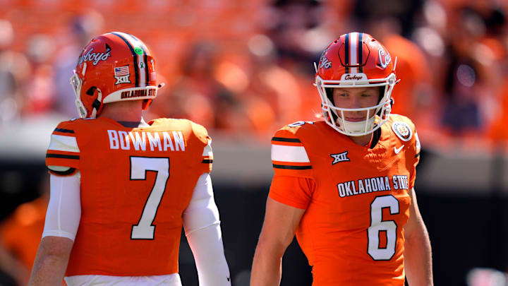 Oklahoma State Cowboys quarterback Zane Flores (6) and quarterback Alan Bowman (7) warm up before a college football game between the Oklahoma State Cowboys (OSU) and the West Virginia Mountaineers at Boone Pickens Stadium in Stillwater, Okla., Saturday, Oct. 5, 2024.