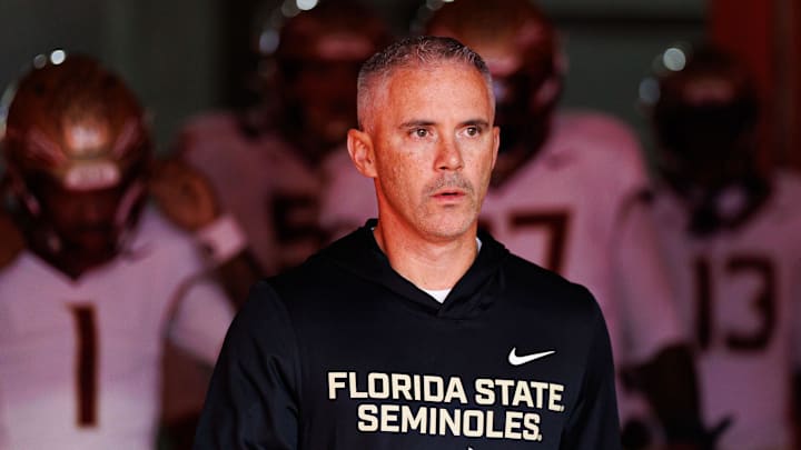 Nov 29, 2025; Gainesville, Florida, USA; Florida State Seminoles head coach Mike Norvell walks out of the tunnel before a game against the Florida Gators at Ben Hill Griffin Stadium. Mandatory Credit: Matt Pendleton-Imagn Images