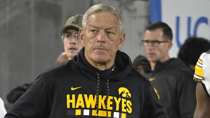 Nov 8, 2024; Pasadena, California, USA;  Iowa Hawkeyes head coach Kirk Ferentz leads his team on to the field for the game against the UCLA Bruins at the Rose Bowl. Mandatory Credit: Jayne Kamin-Oncea-Imagn Images
