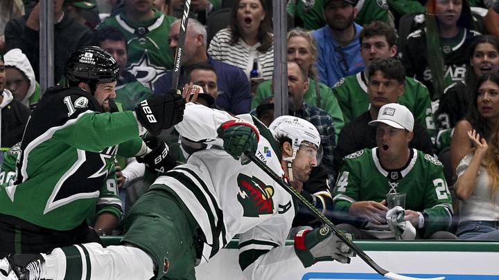 Apr 28, 2026; Dallas, Texas, USA; Dallas Stars left wing Jamie Benn (14) checks Minnesota Wild left wing Marcus Foligno (17) during the second period in game five of the first round of the 2026 Stanley Cup Playoffs at American Airlines Center. Mandatory Credit: Jerome Miron-Imagn Images