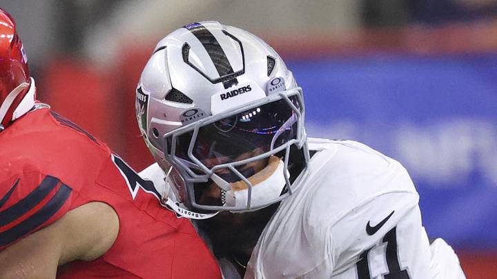 Dec 21, 2025; Houston, Texas, USA; Houston Texans wide receiver Christian Kirk (13) runs with the ball after a reception as Las Vegas Raiders safety Jeremy Chinn (11) attempts to make a tackle during the second quarter at NRG Stadium. Mandatory Credit: Troy Taormina-Imagn Images