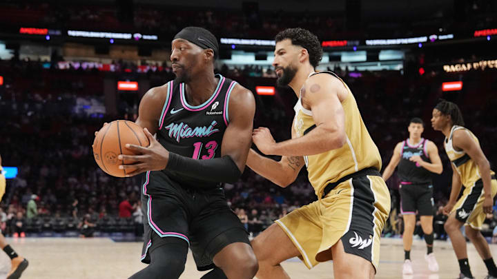 Apr 4, 2026; Miami, Florida, USA; Miami Heat center Bam Adebayo (13) looks to pass the ball as Washington Wizards forward Anthony Gill (16) defends during the first half at Kaseya Center. Mandatory Credit: Jim Rassol-Imagn Images Apr 4, 2026; Miami, Florida, USA; Miami Heat center Bam Adebayo (13) looks to pass the ball as Washington Wizards forward Anthony Gill (16) defends during the first half at Kaseya Center. Mandatory Credit: Jim Rassol-Imagn Images