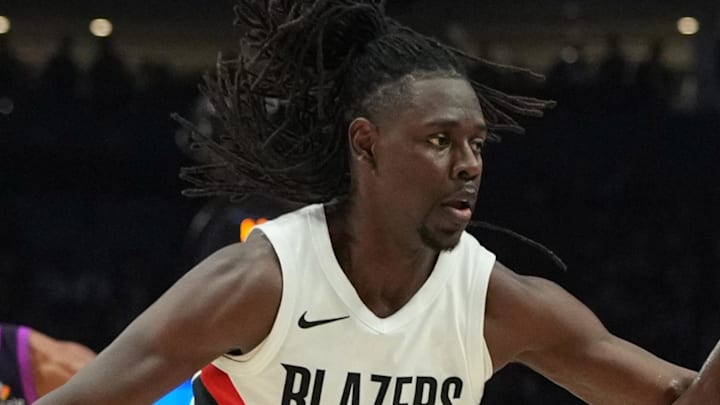 Minnesota Timberwolves guard Anthony Edwards dribbles against Portland Trail Blazers guard Jrue Holiday.