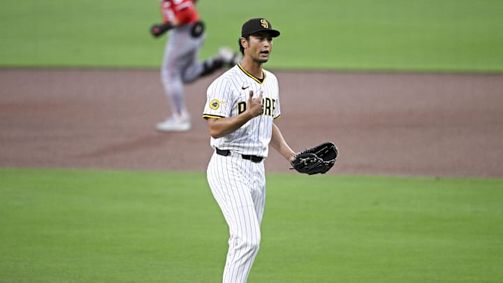 Sep 8, 2025; San Diego, California, USA; San Diego Padres starting pitcher Yu Darvish (11) gestures as Cincinnati Reds center fielder TJ Friedl (29) rounds the bases after hitting a solo home run during the first inning at Petco Park. Mandatory Credit: Denis Poroy-Imagn Images