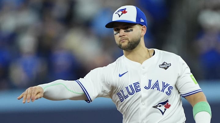 Nov 1, 2025; Toronto, Ontario, CAN; Toronto Blue Jays designated hitter Bo Bichette (11) throws to first for an out against Los Angeles Dodgers second baseman Tommy Edman (25) in the eighth inning during game seven of the 2025 MLB World Series at Rogers Centre. Mandatory Credit: John E. Sokolowski-Imagn Images Nov 1, 2025; Toronto, Ontario, CAN; Toronto Blue Jays designated hitter Bo Bichette (11) throws to first for an out against Los Angeles Dodgers second baseman Tommy Edman (25) in the eighth inning during game seven of the 2025 MLB World Series at Rogers Centre. Mandatory Credit: John E. Sokolowski-Imagn Images
