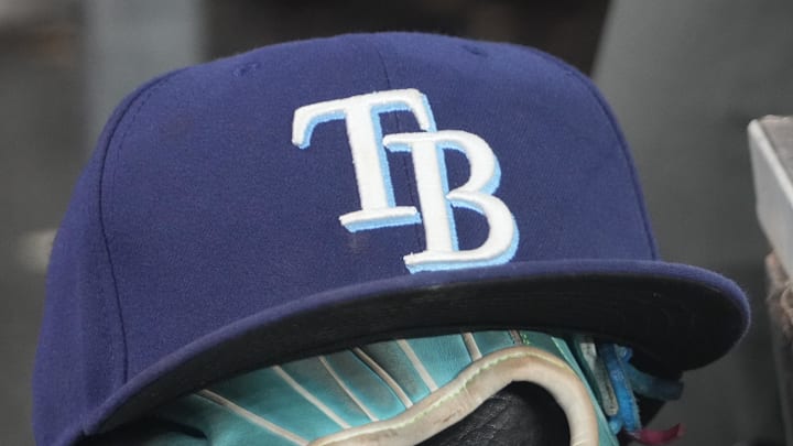 Sep 26, 2025; Toronto, Ontario, CAN; The hat and glove of Tampa Bay Rays third baseman Junior Caminero (13) in the dugout during the game against the Toronto Blue Jays at Rogers Centre. Sep 26, 2025; Toronto, Ontario, CAN; The hat and glove of Tampa Bay Rays third baseman Junior Caminero (13) in the dugout during the game against the Toronto Blue Jays at Rogers Centre.