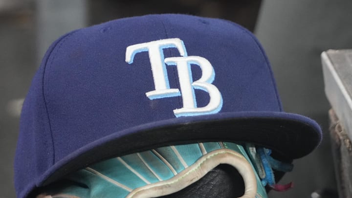 Sep 26, 2025; Toronto, Ontario, CAN; The hat and glove of Tampa Bay Rays third baseman Junior Caminero (13) in the dugout during the game against the Toronto Blue Jays at Rogers Centre. 