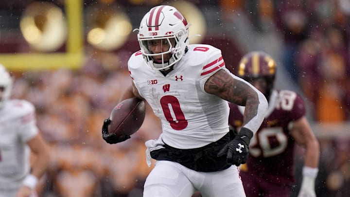 Wisconsin running back Braelon Allen (0) runs for a first down during the second quarter of their game Saturday, November 25, 2023 at Huntington Bank Stadium in Minneapolis, Minnesota. Wisconsin beat Minnesota 28-14.