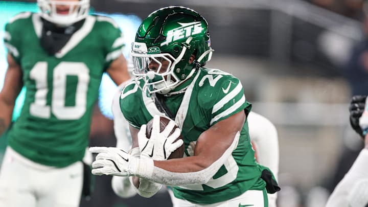 Jan 5, 2025; East Rutherford, New Jersey, USA; New York Jets running back Breece Hall (20) carries the ball during the second half against the Miami Dolphins at MetLife Stadium. Mandatory Credit: Vincent Carchietta-Imagn Images