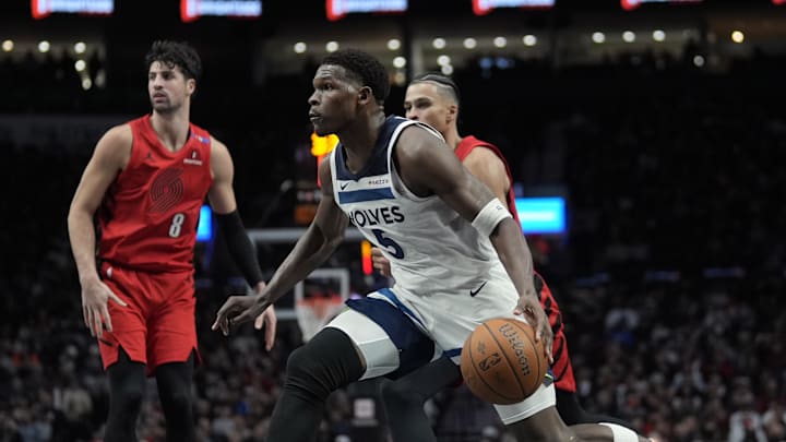 Nov 12, 2024; Portland, Oregon, USA; Minnesota Timberwolves shooting guard Anthony Edwards (5) drives to the basket during the second half against the Portland Trail Blazers at Moda Center.
