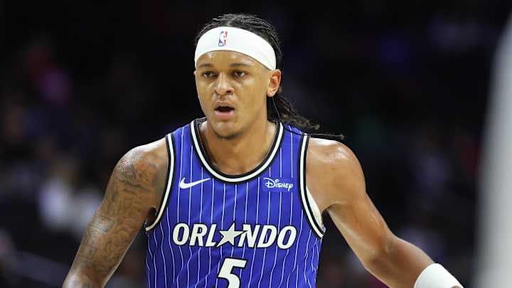 Oct 10, 2025; Philadelphia, Pennsylvania, USA; Orlando Magic forward Paolo Banchero (5) dribbles the ball against the Philadelphia 76ers during the third quarter at Xfinity Mobile Arena. Mandatory Credit: Bill Streicher-Imagn Images Oct 10, 2025; Philadelphia, Pennsylvania, USA; Orlando Magic forward Paolo Banchero (5) dribbles the ball against the Philadelphia 76ers during the third quarter at Xfinity Mobile Arena. Mandatory Credit: Bill Streicher-Imagn Images
