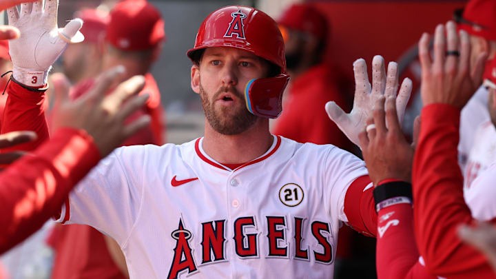 Sep 15, 2024; Anaheim, California, USA;  Los Angeles Angels left fielder Taylor Ward (3) is greeted in the dugout after hitting a home run during the eighth inning against the Houston Astros at Angel Stadium. Mandatory Credit: Kiyoshi Mio-Imagn Images