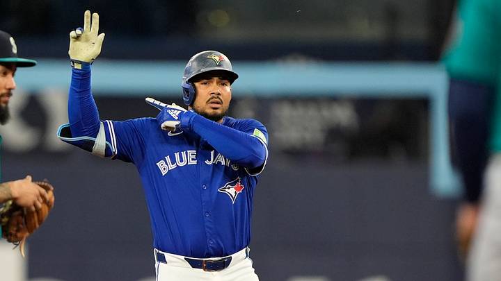 Oct 12, 2025; Toronto, Ontario, CAN; Toronto Blue Jays right fielder Anthony Santander (25) celebrates at second base in the second inning against the Seattle Mariners during game one of the ALCS round for the 2025 MLB playoffs at Rogers Centre. Mandatory Credit: John E. Sokolowski-Imagn Images