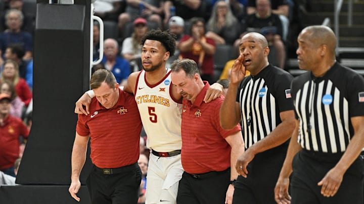 Mar 20, 2026; St. Louis, MO, USA; Iowa State Cyclones forward Joshua Jefferson (5) is helped off of the court after suffering an apparent injury to his left leg while shooting a layup against Tennessee State Tigers forward Jalen Pitre (not pictured) during the first half of a first round game of the men's 2026 NCAA Tournament at Enterprise Center. Mandatory Credit: Jeff Le-Imagn Images Mar 20, 2026; St. Louis, MO, USA; Iowa State Cyclones forward Joshua Jefferson (5) is helped off of the court after suffering an apparent injury to his left leg while shooting a layup against Tennessee State Tigers forward Jalen Pitre (not pictured) during the first half of a first round game of the men's 2026 NCAA Tournament at Enterprise Center. Mandatory Credit: Jeff Le-Imagn Images