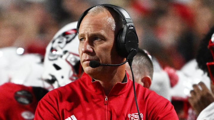 Nov 1, 2025; Raleigh, North Carolina, USA;  NC State Wolfpack head coach Dave Doeren during the first quarter at Carter-Finley Stadium. Mandatory Credit: Zachary Taft-Imagn Images