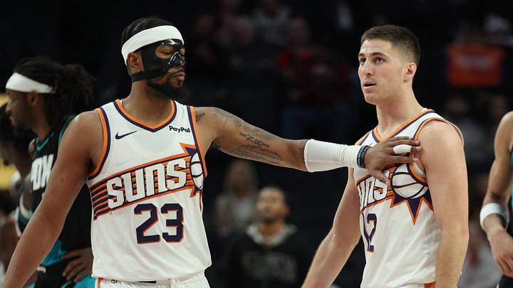 Feb 3, 2026; Portland, Oregon, USA;  Phoenix Suns guard Jordan Goodwin (23) recognizes teammate guard Collin Gillespie (12) during the second half against the Portland Trail Blazers at Moda Center. Mandatory Credit: Jaime Valdez-Imagn Images