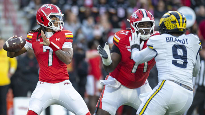 Nov 22, 2025; College Park, Maryland, USA; Maryland Terrapins offensive lineman Alan Herron (71) blocks for quarterback Malik Washington (7) during the first half against the Michigan Wolverines at SECU Stadium.