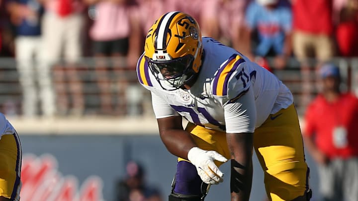 Sep 27, 2025; Oxford, Mississippi, USA; LSU Tigers offensive lineman Paul Mubenga (65) and offensive lineman Tyree Adams (71) wait for the snap during the third quarter against the Mississippi Rebels at Vaught-Hemingway Stadium. Mandatory Credit: Petre Thomas-Imagn Images