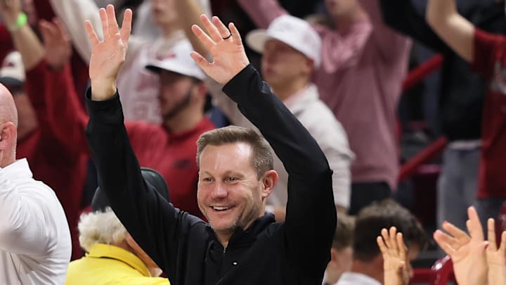 Arkansas Razorbacks coach Ryan Silverfield “Calls the Hogs” during the second half against the James Madison Dukes at Bud Walton Arena. Arkansas won 103-74.