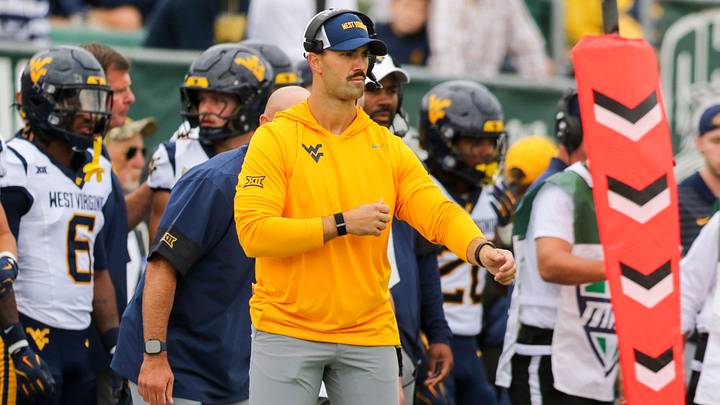Sep 6, 2025; Athens, Ohio, USA; West Virginia Mountaineers defensive coordinator Zac Alley calls out plays from the sidelines during the first quarter against the West Virginia Mountaineers at Peden Stadium. Mandatory Credit: Ben Queen-Imagn Images Sep 6, 2025; Athens, Ohio, USA; West Virginia Mountaineers defensive coordinator Zac Alley calls out plays from the sidelines during the first quarter against the West Virginia Mountaineers at Peden Stadium. Mandatory Credit: Ben Queen-Imagn Images