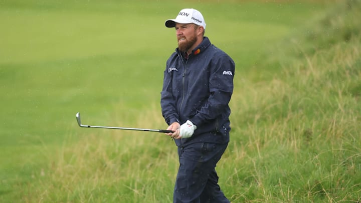 A virus and a two-stroke penalty has Shane Lowry near the bottom of the British Open leaderboard. 