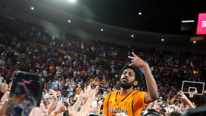ASU Sun Devils guard Moe Odum (5) celebrates with fans after their 70-60 win over the Kansas Jayhawks at Desert Financial Arena in Tempe on March 3, 2026.
