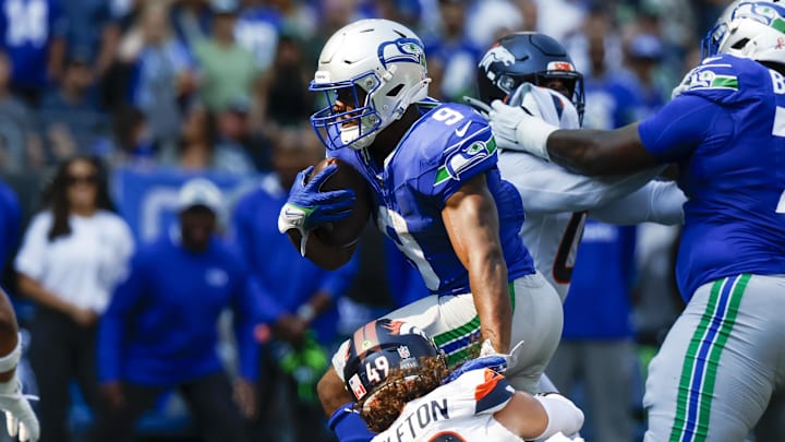 Sep 8, 2024; Seattle, Washington, USA; Seattle Seahawks running back Kenneth Walker III (9) breaks a tackle attempt by Denver Broncos linebacker Alex Singleton (49) to rush for a touchdown during the third quarter at Lumen Field. Mandatory Credit: Joe Nicholson-Imagn Images Sep 8, 2024; Seattle, Washington, USA; Seattle Seahawks running back Kenneth Walker III (9) breaks a tackle attempt by Denver Broncos linebacker Alex Singleton (49) to rush for a touchdown during the third quarter at Lumen Field. Mandatory Credit: Joe Nicholson-Imagn Images