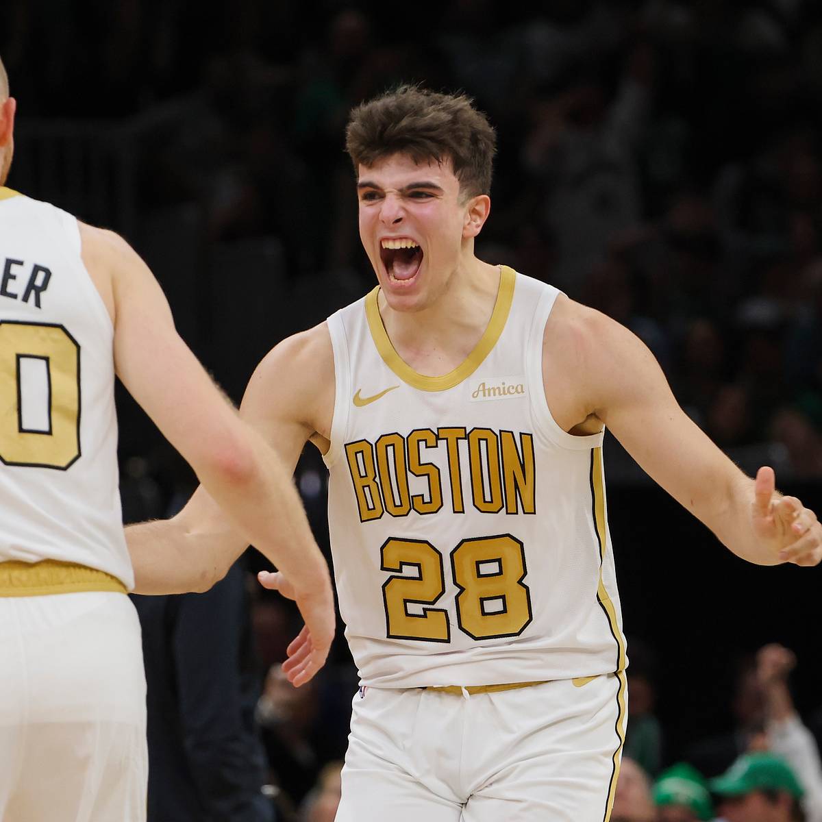 Hugo Gonzalez celebrates with Sam Hauser for Boston Celtics