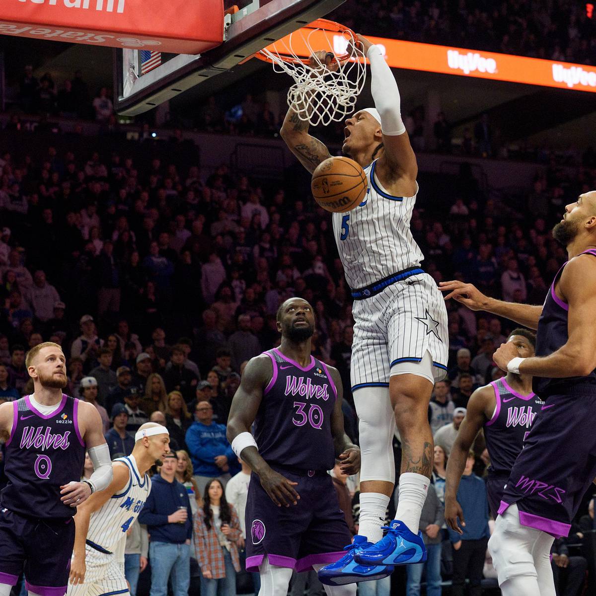 Paolo Banchero dunks for the Orlando Magic against Minnesota Timberwolves defenders in 2026