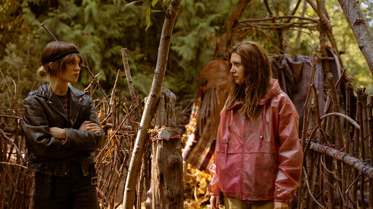 Teen Natalie and Shauna face each other at the wilderness camp in Yellowjackets Season 3.