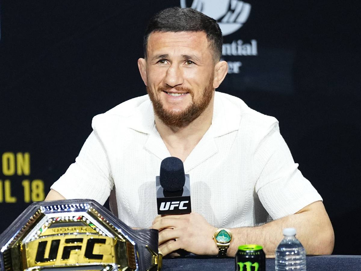 Merab Dvalishvili speaking at UFC 323 press conference in December 2025