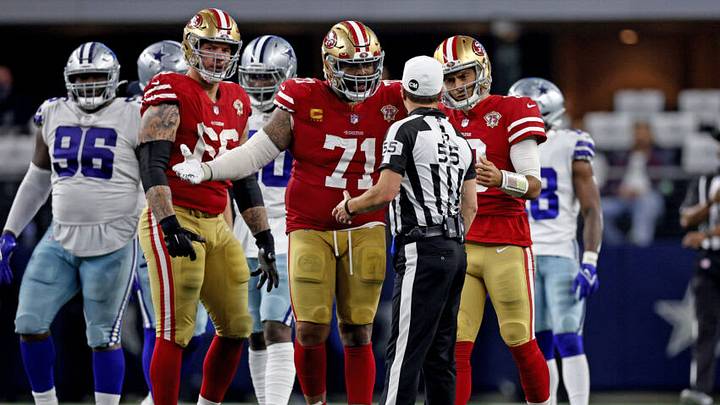 Trent Williams and Jimmy Garoppolo during the January 2022 playoff game against Dallas