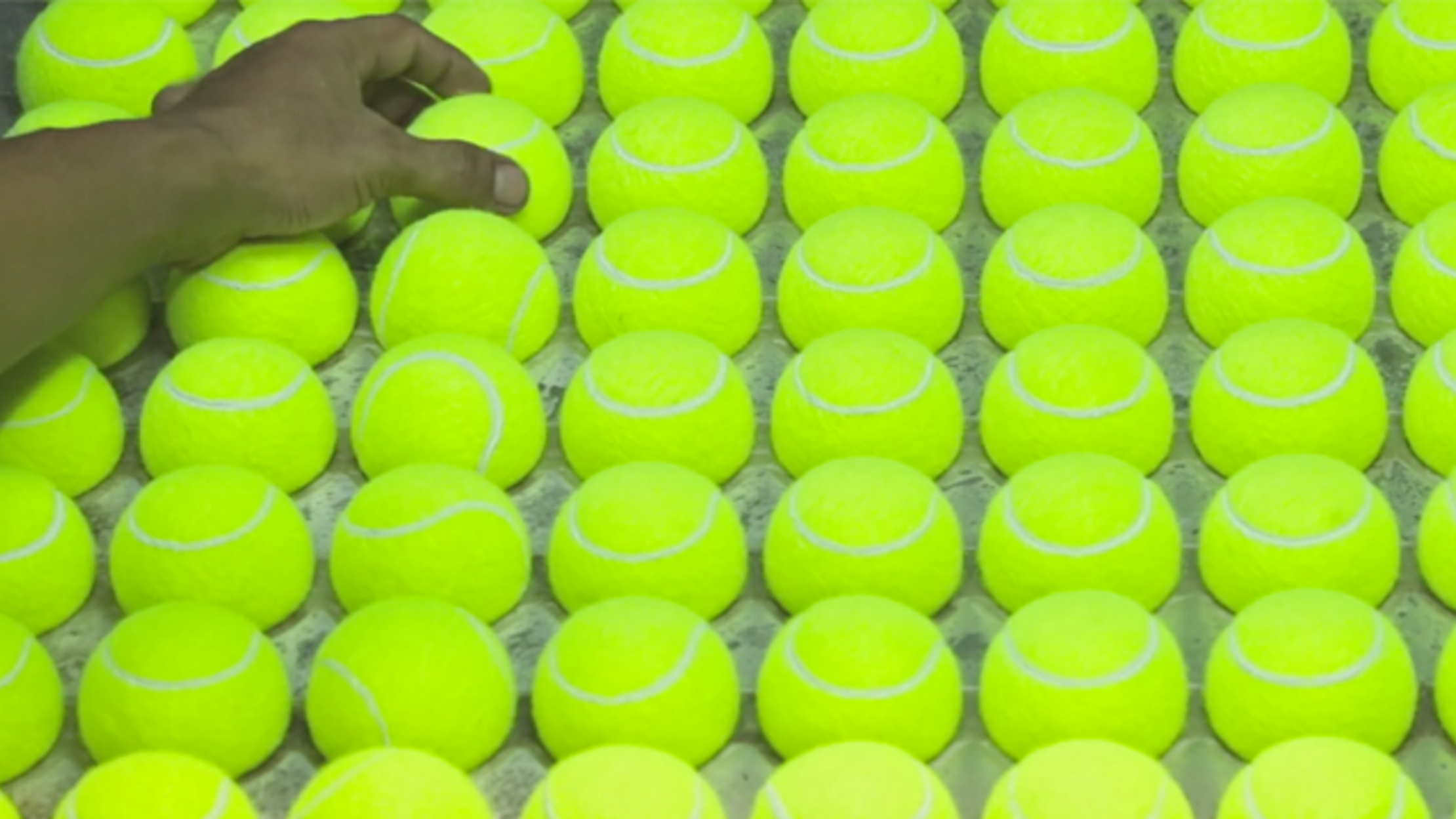 This Mesmerizing Video Shows How Tennis Balls Are Made | Mental Floss