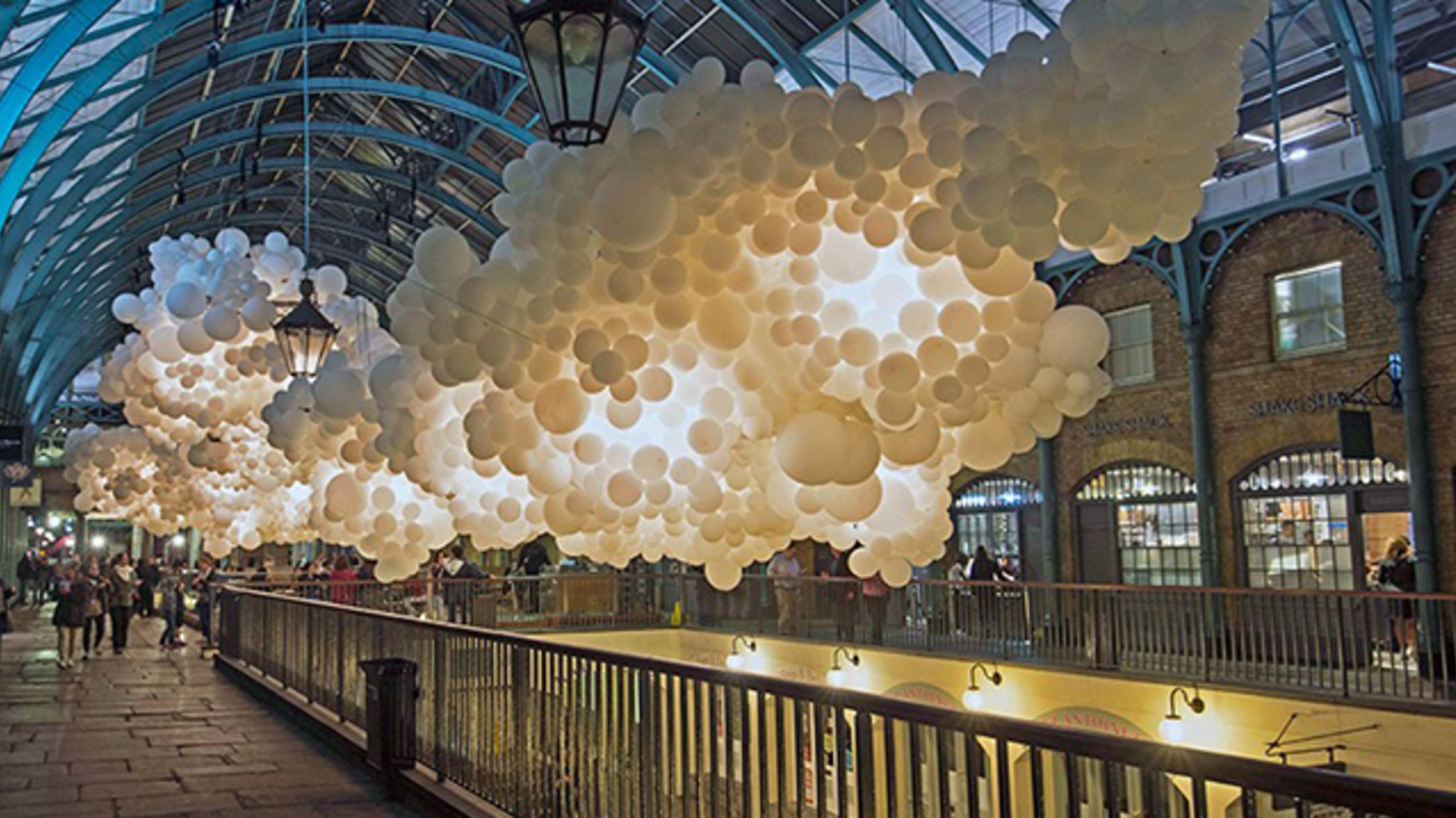 100,000 White Balloons Turn a London Shopping Center Into a Cloud Mental Floss