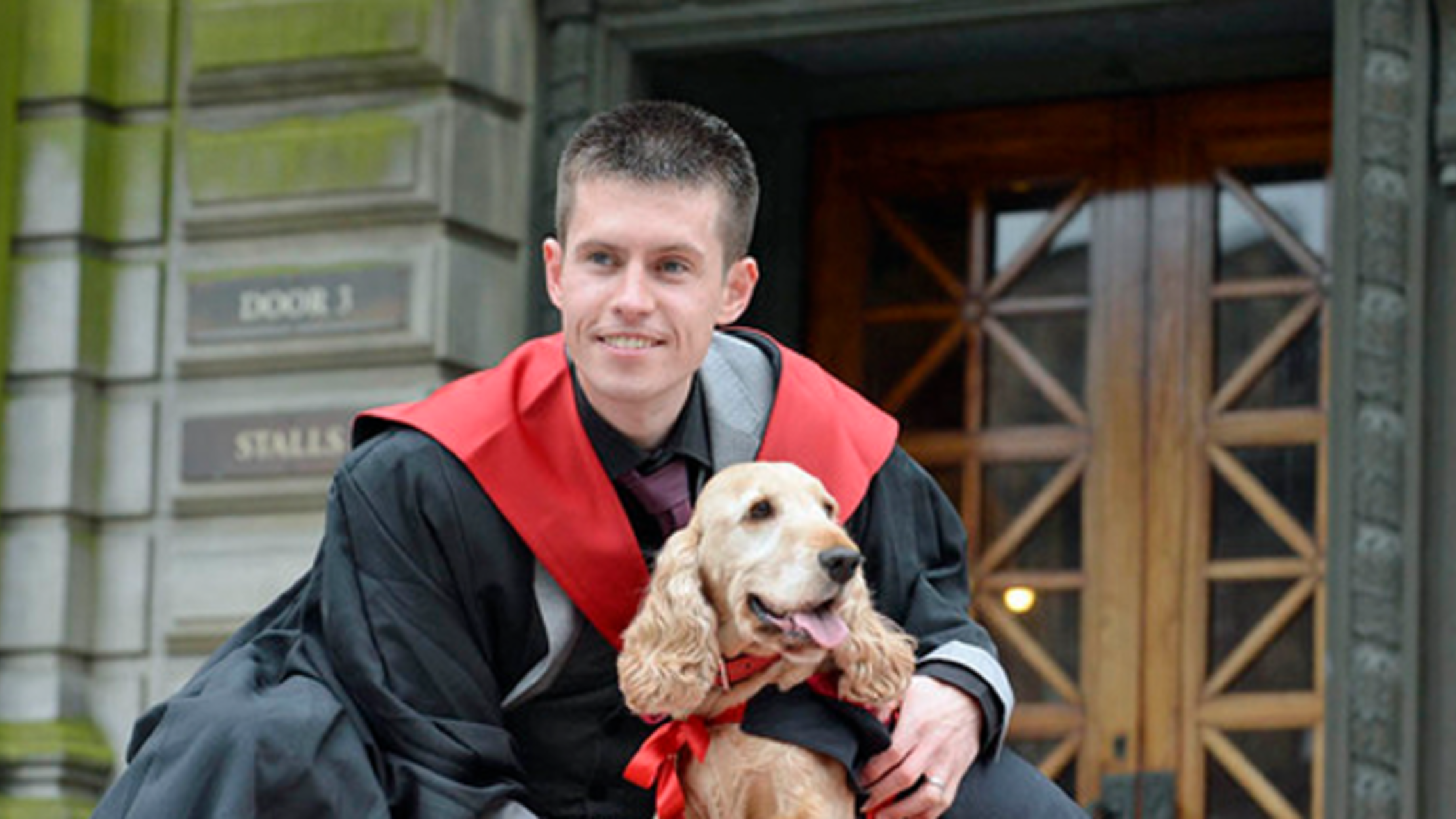Man and Dog Graduate Together in Matching Robes Mental Floss