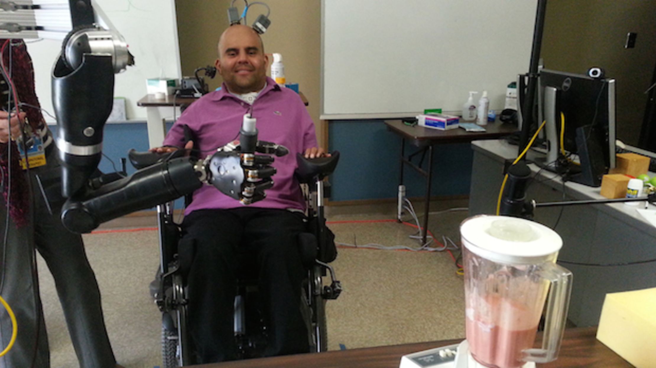 MindControlled Robotic Arm Helps Paralyzed Man Drink Beer