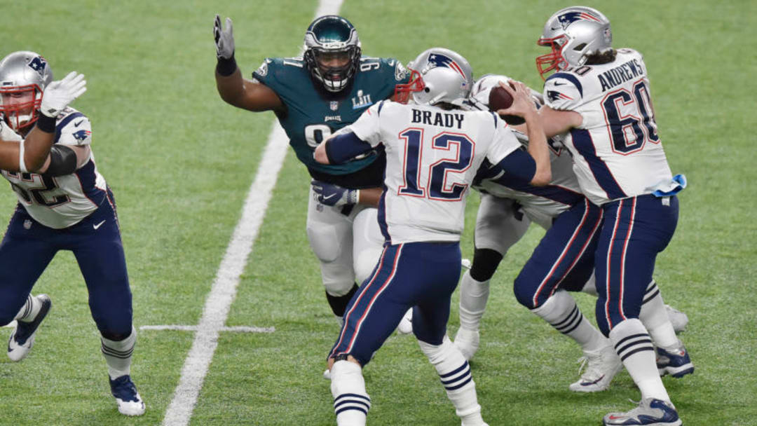 MINNEAPOLIS, MN - FEBRUARY 04: Fletcher Cox #91 of the Philadelphia Eagles puts pressure on quarterback Tom Brady #12 of the New England Patriots during Super Bowl LII at U.S. Bank Stadium on February 4, 2018 in Minneapolis, Minnesota. The Eagles defeated the Patriots 41-33. (Photo by Focus on Sport/Getty Images) *** Local Caption *** Fletcher Cox; Tom Brady