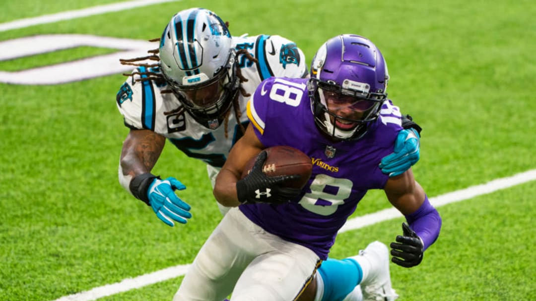 MINNEAPOLIS, MN - NOVEMBER 29: Justin Jefferson #18 of the Minnesota Vikings scores a touchdown during the fourth quarter against the Carolina Panthers at U.S. Bank Stadium on November 29, 2020 in Minneapolis, Minnesota. (Photo by Stephen Maturen/Getty Images)