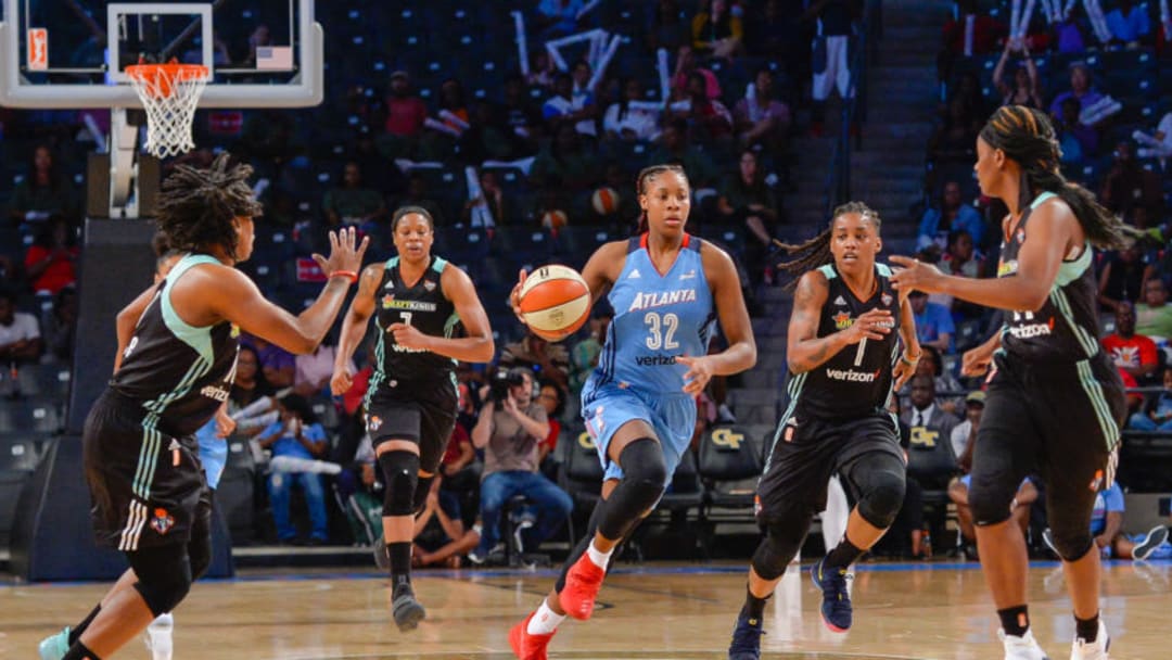 ATLANTA, GA JULY 02: Atlanta's Bria Holmes (32) draws a crowd of New York defenders during a WNBA game between the Atlanta Dream and the New York Liberty on July 2, 2017 at Hank McCamish Pavilion in Atlanta, GA. The Atlanta Dream defeated the New York Liberty 81 72. (Photo by Rich von Biberstein/Icon Sportswire via Getty Images)